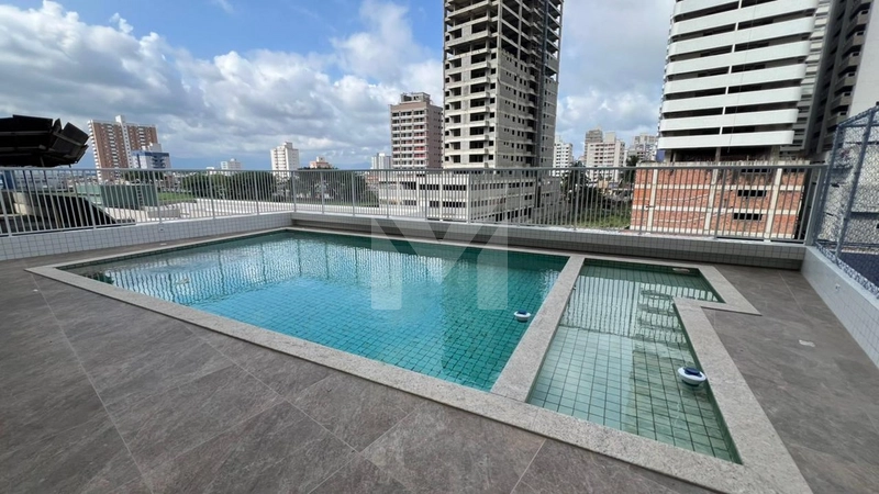 Prédio novo pertinho da praia