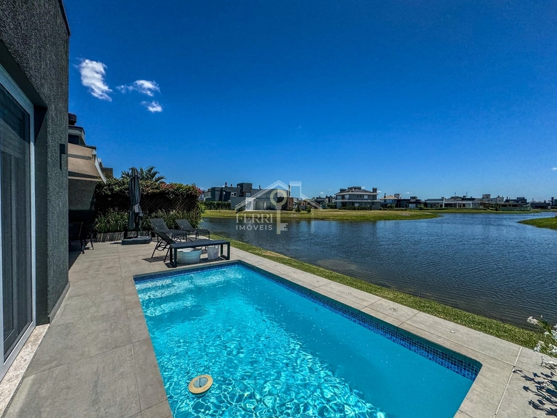 Casa beira-lago com 4 suítes e piscina no condomínio Riviera Xangri-lá: 25ª foto da galeria de imagens do imóvel