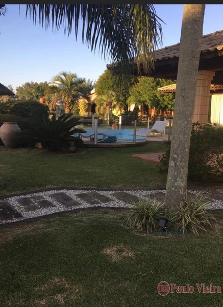 ATLÂNTIDA - ENCANTADORA CASA EM AMPLO TERRENO: 25ª foto da galeria de imagens do imóvel