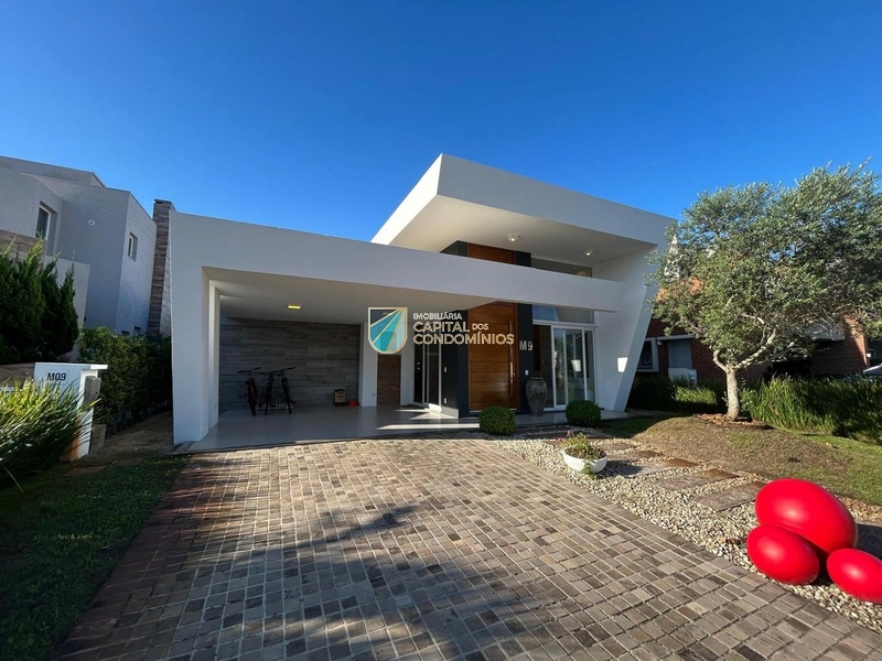 Casa beira lago no condomínio Malibu em Xangri-lá: 2ª foto da galeria de imagens do imóvel