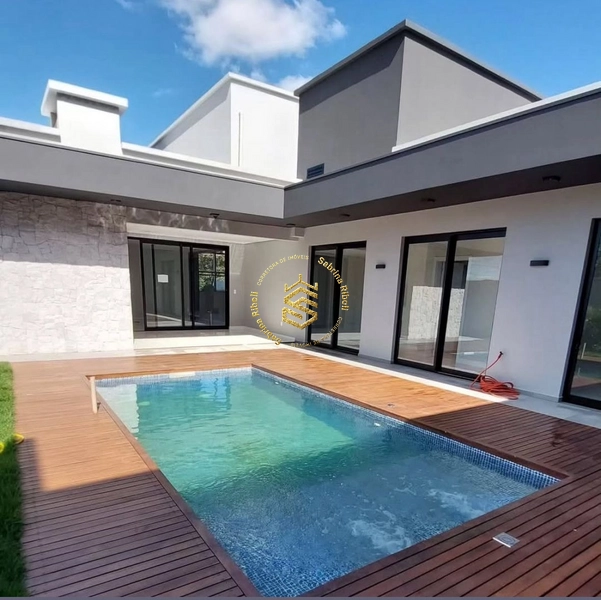 CASA COM 03 SUÍTES, 4 VAGAS DE GARRAGEM.: 4ª foto da galeria de imagens do imóvel