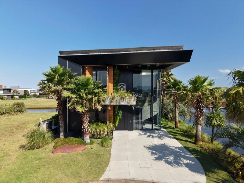 Casa beira lago 6 suítes à venda em condomínio de Xangri-lá