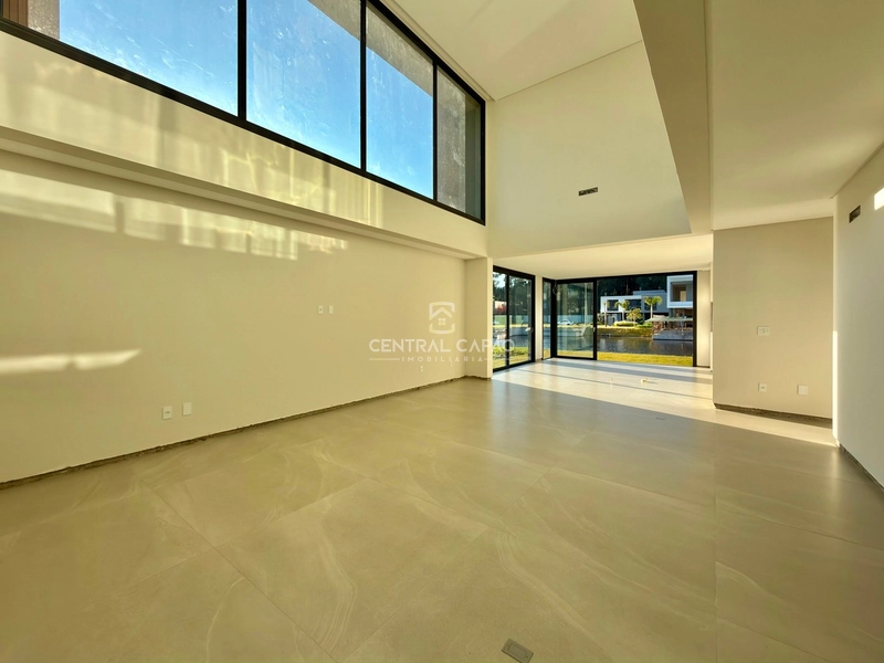 Casa beira lago no condomínio Amaná em Atlântida: 4ª foto da galeria de imagens do imóvel