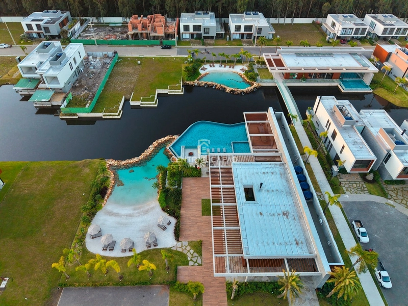 Casa beira lago no condomínio Amaná em Atlântida: 39ª foto da galeria de imagens do imóvel