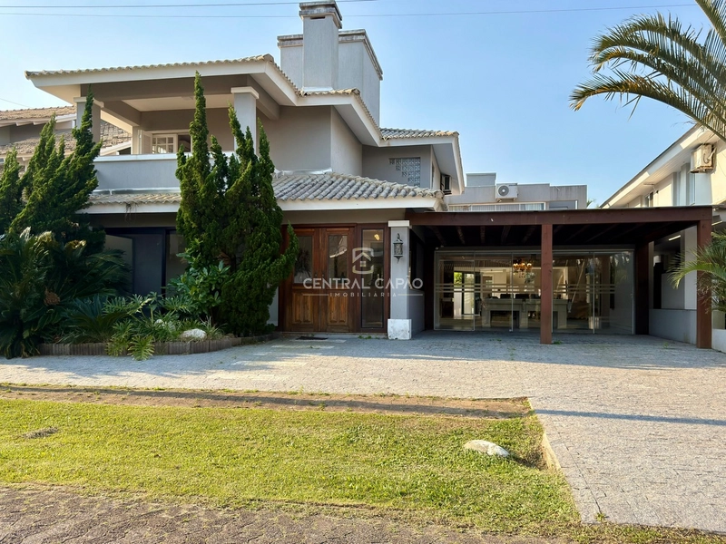 Casa 3 dormitórios com piscina à venda em Xangri-Lá: 1ª foto da galeria de imagens do imóvel