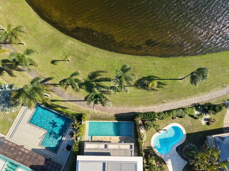 Casa 4 suítes beira lago no condomínio Bosques de Atlântida: 3ª foto da galeria de imagens do imóvel