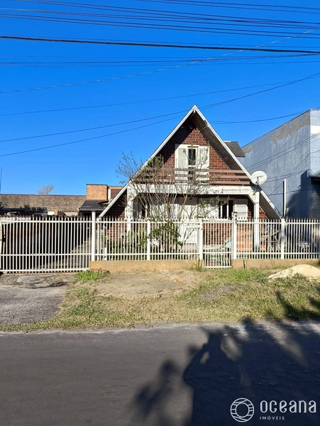terreno com 3 casas com alto potencial comercial em capao da canoa: 1ª foto da galeria de imagens do imóvel