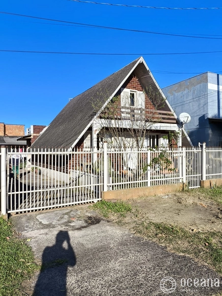 terreno com 3 casas com alto potencial comercial em capao da canoa: 2ª foto da galeria de imagens do imóvel