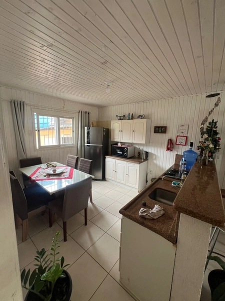 Casa com piscina em Capão da Canoa: 3ª foto da galeria de imagens do imóvel