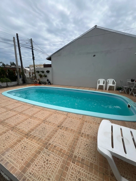 Casa com piscina em Capão da Canoa: 1ª foto da galeria de imagens do imóvel