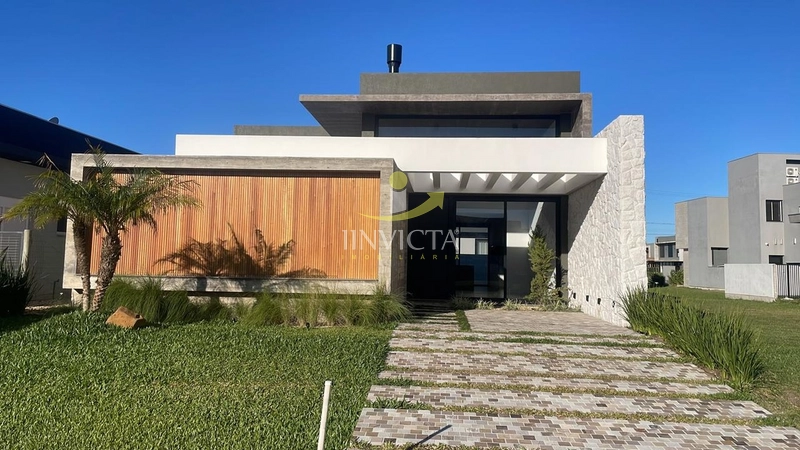 casa terrea com 4 suites em condominio fechado em Xangri-lá: 1ª foto da galeria de imagens do imóvel