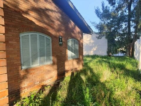 Terreno em Atlântida com casa térrea: 2ª foto da galeria de imagens do imóvel