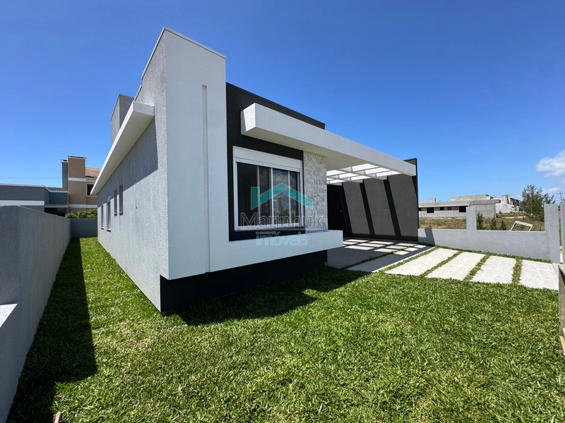 Casa em Atlântida Sul: 2ª foto da galeria de imagens do imóvel