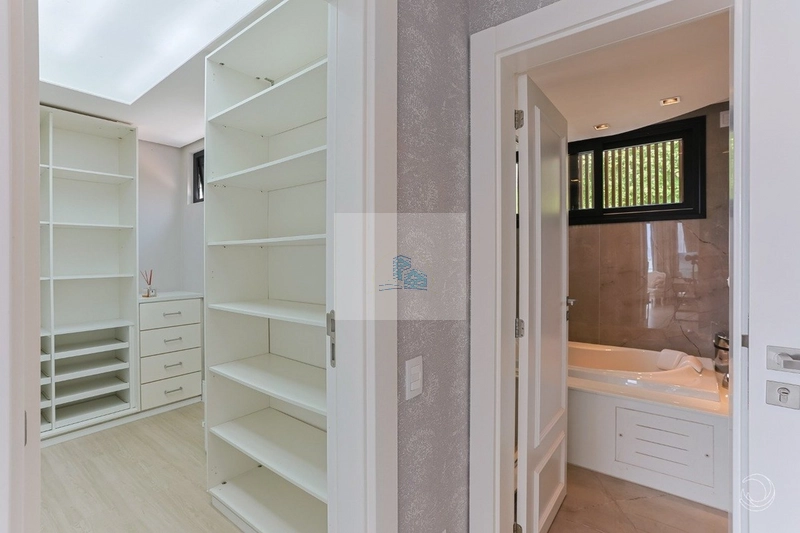 Casa em condomínio fechado com 5 suítes em Cacupé: 15ª foto da galeria de imagens do imóvel