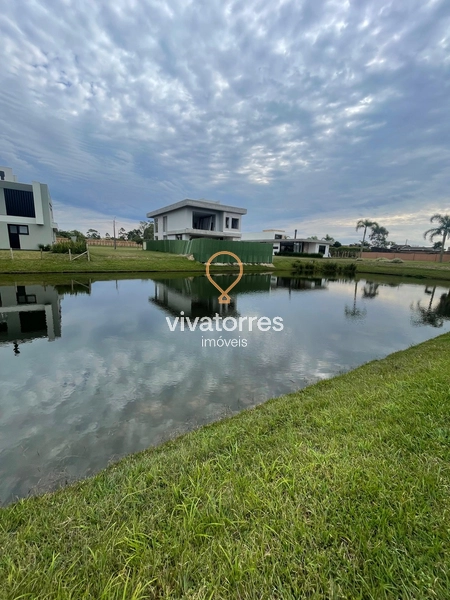 Lote fundos lago em condomínio fechado de Torres: 8ª foto da galeria de imagens do imóvel