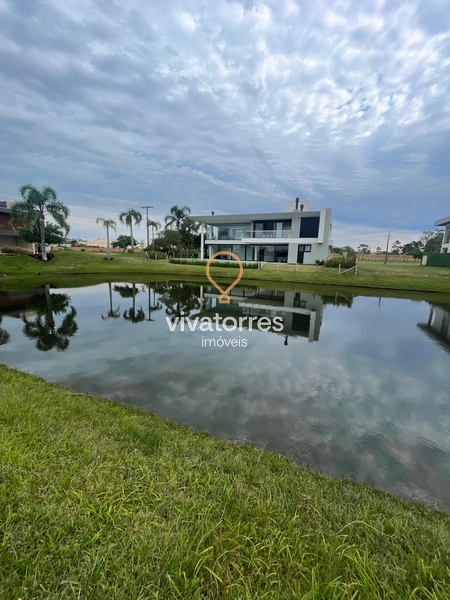 Lote fundos lago em condomínio fechado de Torres: 7ª foto da galeria de imagens do imóvel