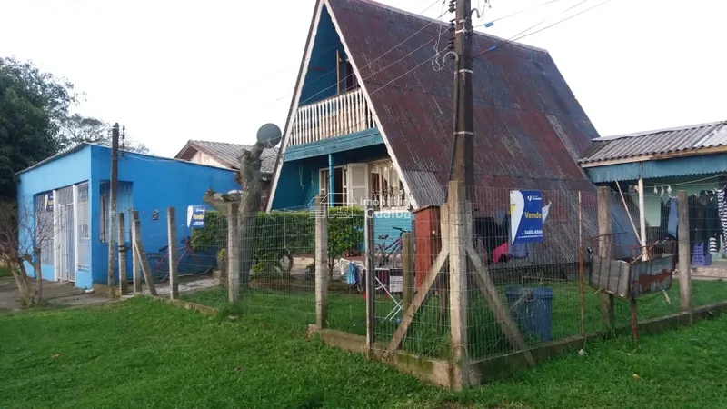 Terreno de esquina com casas: 5ª foto da galeria de imagens do imóvel