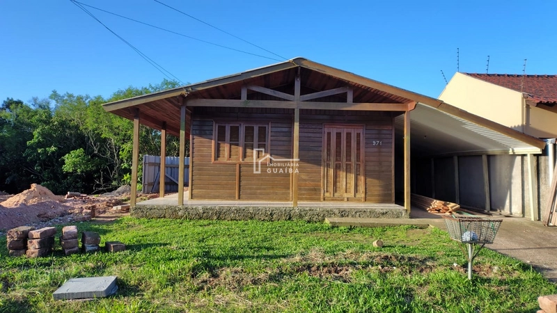 Bela casa de madeira á venda no bairro Jardim dos Lagos -Guaíba -RS: 3ª foto da galeria de imagens do imóvel