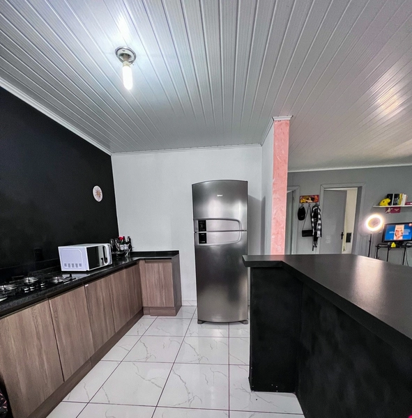 Casa com anexo nos fundos em Capão da Canoa: 2ª foto da galeria de imagens do imóvel