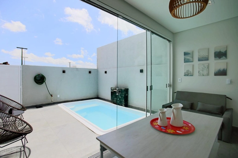 Casa com padrão único com 3 dormitórios e piscina no bairro Zona Nova: 9ª foto da galeria de imagens do imóvel