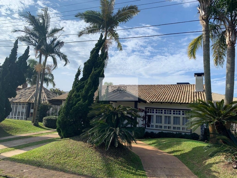 Casa com 2 terrenos e meio em condomínio de Atlântida: 1ª foto da galeria de imagens do imóvel