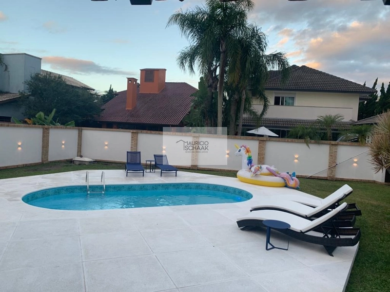 Casa com 2 terrenos e meio em condomínio de Atlântida: 2ª foto da galeria de imagens do imóvel