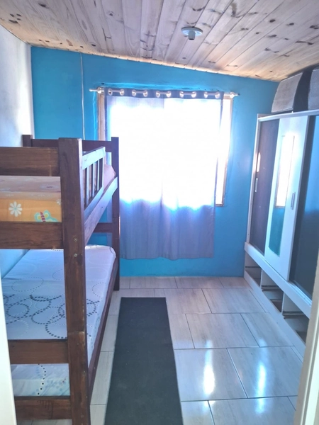 CASA DE TERRENO INTEIRO LADO MAR EM CAPÃO NOVO: 2ª foto da galeria de imagens do imóvel