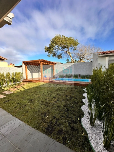 Casa ampla no Centro de Imbé – 4 dormitórios, piscina e espaço gourmet: 16ª foto da galeria de imagens do imóvel