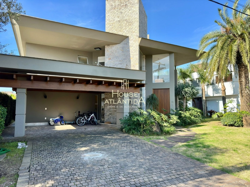 Sobrado a venda no Condomínio Bosques de Atlântida, na beira lago: 1ª foto da galeria de imagens do imóvel