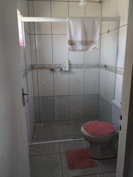 Casa Aconchegante com 2 Dormitórios, Garagem Fechada e Pátio Amplo: 16ª foto da galeria de imagens do imóvel