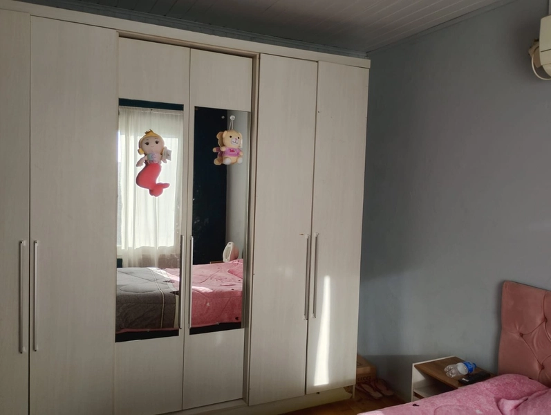 Casa Aconchegante com 2 Dormitórios, Garagem Fechada e Pátio Amplo: 13ª foto da galeria de imagens do imóvel