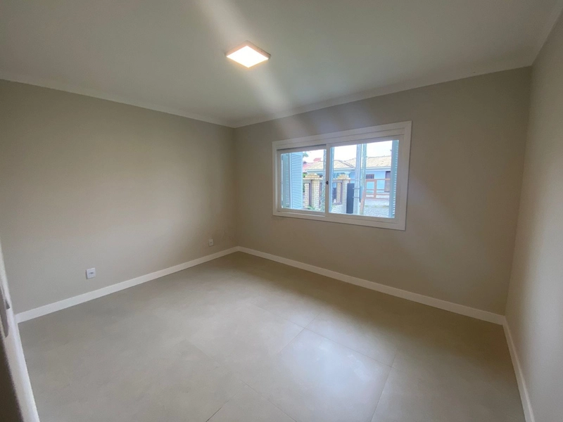 Residência Moderna no Centro – 3 Dormitórios, 2 Suítes e Amplo Pátio!: 11ª foto da galeria de imagens do imóvel