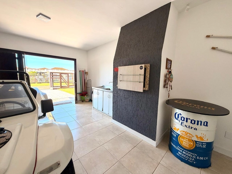 Casa com 3 Dormitórios, Living integrado e Garagem com Churrasqueira!: 18ª foto da galeria de imagens do imóvel