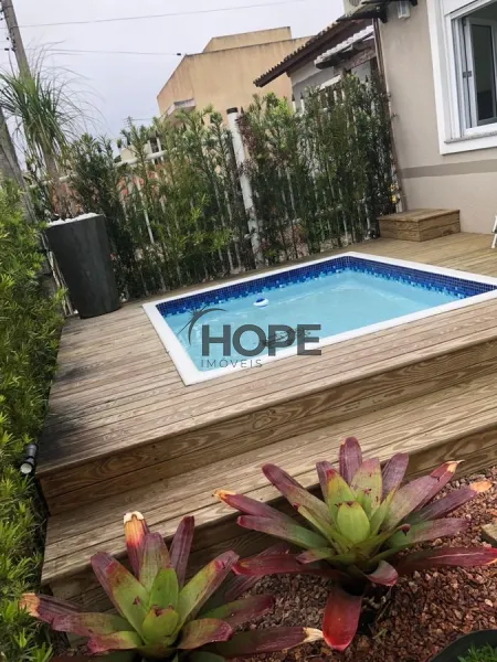 Casa mobiliada, decorada e com sistema de automação completo em Capão: 2ª foto da galeria de imagens do imóvel