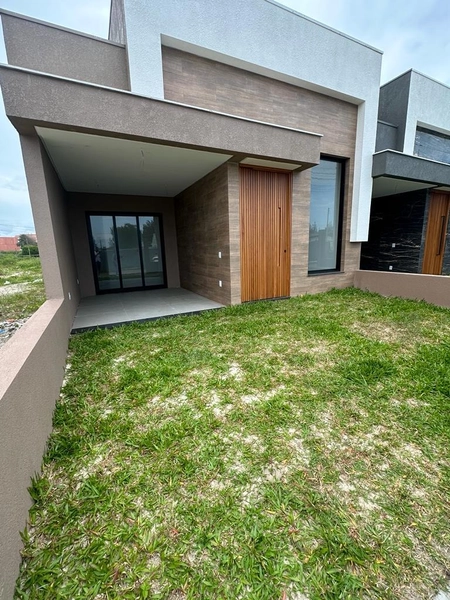 Casa 3 dormitórios sendo 1 suíte americana  em CAPÃO DA CANOA/Zona Nor: 1ª foto da galeria de imagens do imóvel