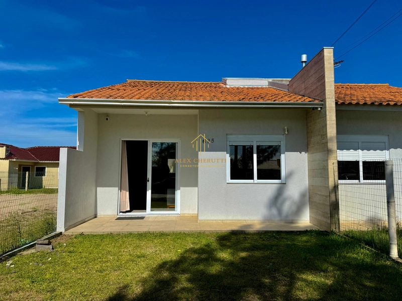 Bela casa geminada na praia de Atlântida Sul: 3ª foto da galeria de imagens do imóvel