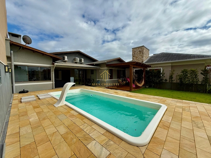 Casa na Praia de Atlântida Sul, 3 dormitórios: 2ª foto da galeria de imagens do imóvel