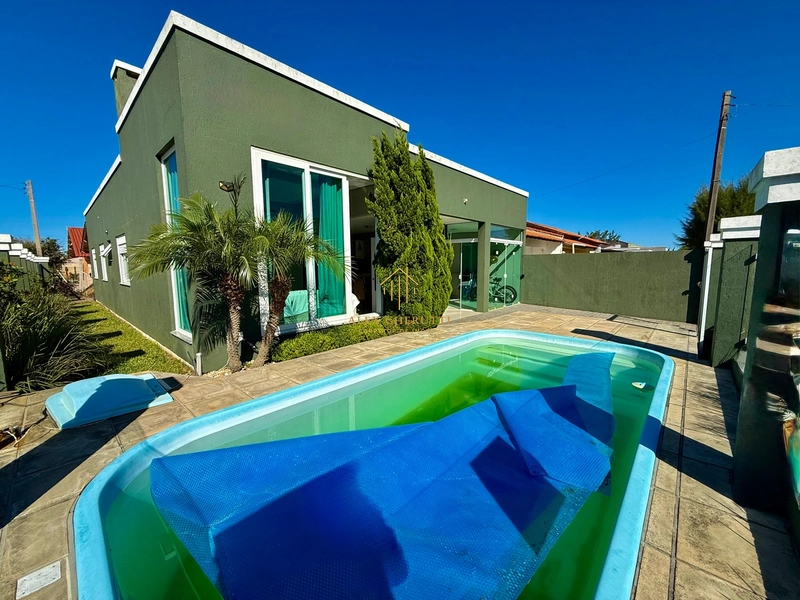 Bela casa à venda na praia de Atlântida Sul, 4 dormitórios: 3ª foto da galeria de imagens do imóvel