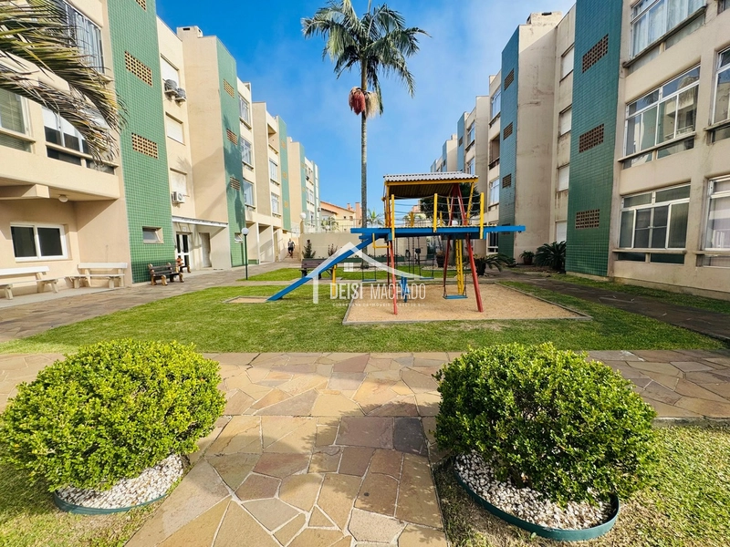 Apartamento térreo a venda em prédio com piscina em Capão Novo