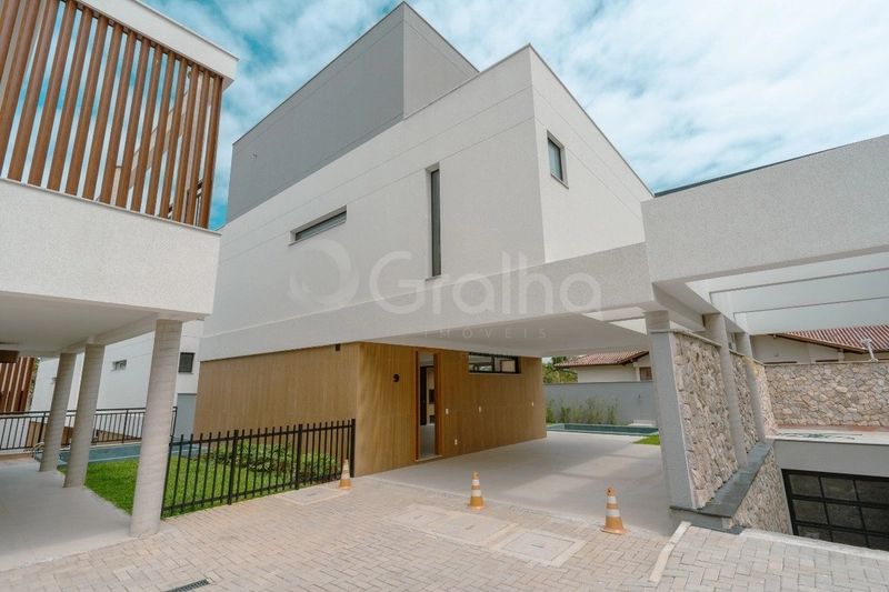 Casa em condomínio fechado em Cacupé com 4 suítes: 1ª foto da galeria de imagens do imóvel