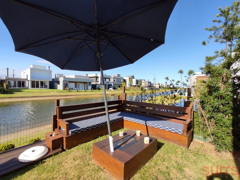 Linda casa beira lago com piscina no Condomínio Riviera: 30ª foto da galeria de imagens do imóvel