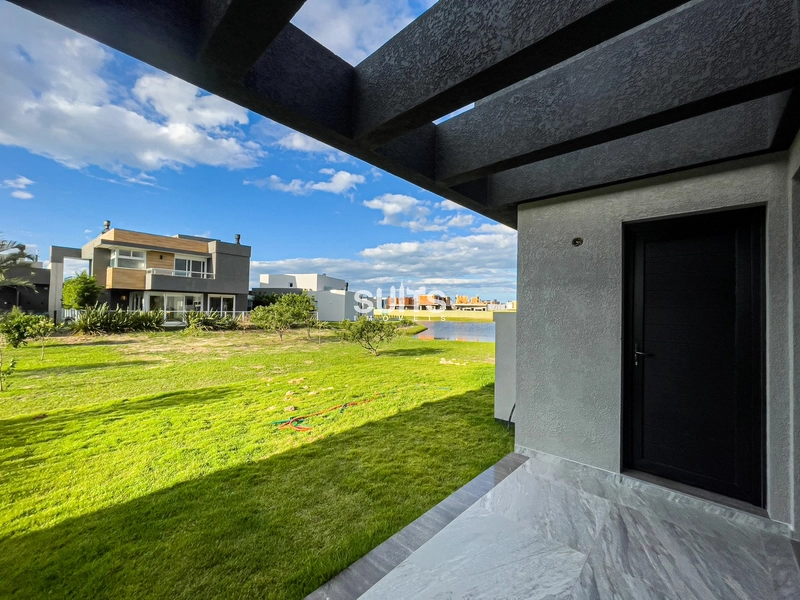 Incrível casa com linda vista para o lago no condomínio Riviera: 11ª foto da galeria de imagens do imóvel