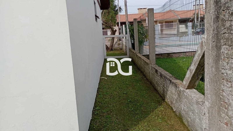 Casa aconchegante, composta por 2 dormitórios bem distribuídos: 19ª foto da galeria de imagens do imóvel