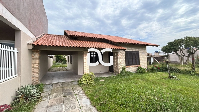Casa composta por 3 dormitórios, sendo 1 suíte, oferecendo conforto: 1ª foto da galeria de imagens do imóvel