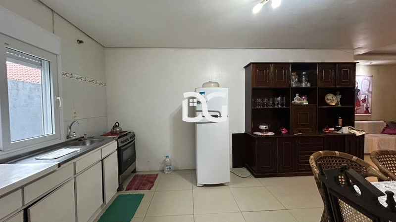 Casa aconchegante, composta por 2 dormitórios bem iluminados: 13ª foto da galeria de imagens do imóvel