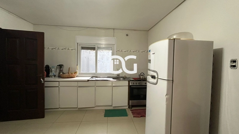 Casa aconchegante, composta por 2 dormitórios bem iluminados: 10ª foto da galeria de imagens do imóvel