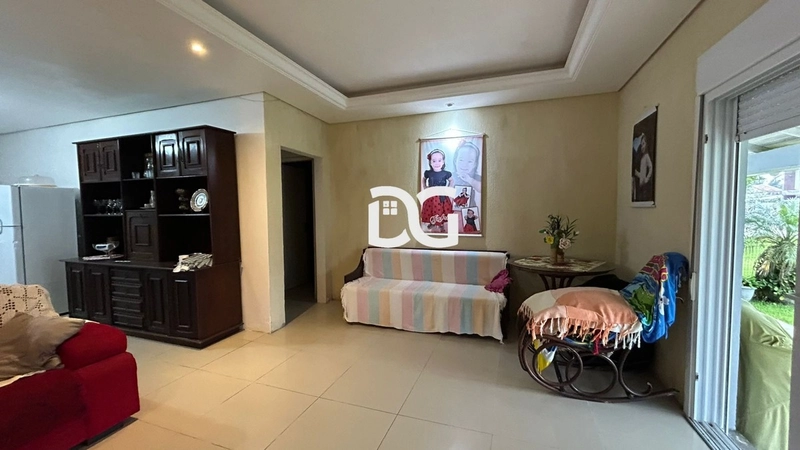 Casa aconchegante, composta por 2 dormitórios bem iluminados: 5ª foto da galeria de imagens do imóvel