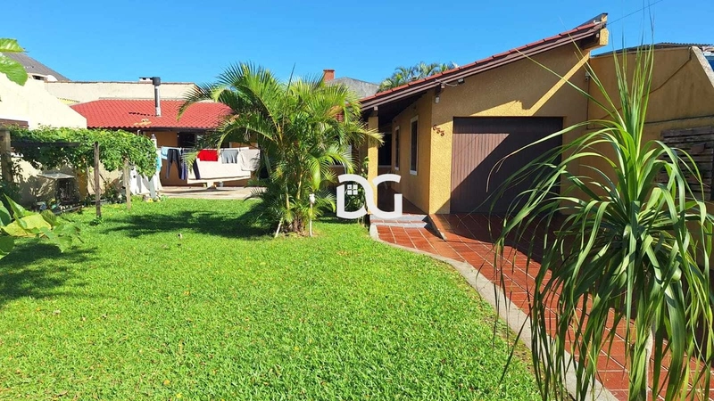 Casa aconchegante e bem distribuída, composta por 3 dormitórios: 1ª foto da galeria de imagens do imóvel