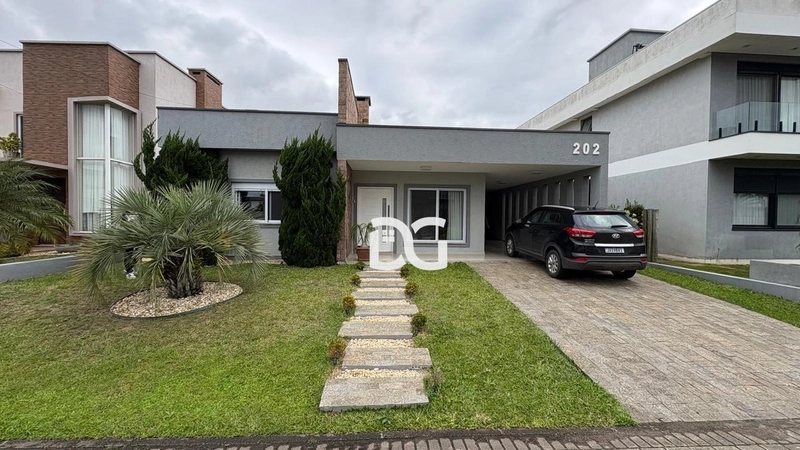 Apresentamos esta belíssima casa térrea com 3 suítes: 1ª foto da galeria de imagens do imóvel