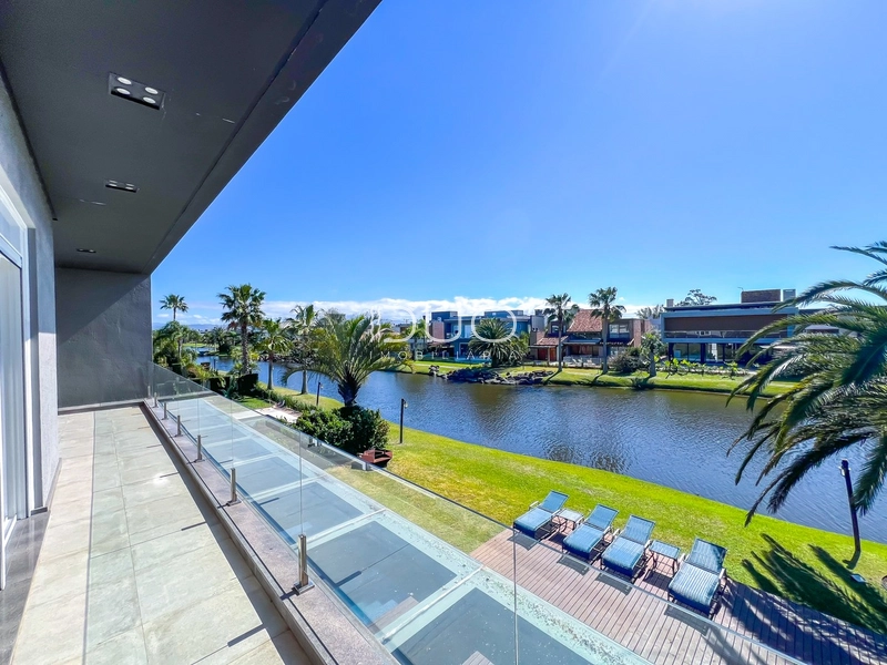 CASA COM 5 DORMITÓRIOS NO CONDOMÍNIO VILLAGIO DE ATLANTIDA: 5ª foto da galeria de imagens do imóvel